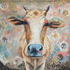 A limited edition giclee print of a beautiful creamy coloured Indian cow interspersed with pinks and turquoises with holy red tika on her forehead. There is an ornate gold block print through the background.  This is a very cool piece and sits well as a good contrast to either Bling or Tika 