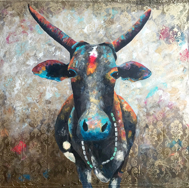 A limited edition giclee print of an Indian cow from the holy town of Gokhana. She is wearing a Mala necklace and is highly decorated. There is a beautiful gold print through the background
