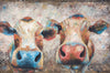 A limited edition giclee print of two cows on archival fine art paper. This image shows 2 cows that are clearly happy and having a good time. The colours used are beautiful turquoises and coral tones with gold print overlay.