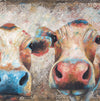 A limited edition giclee print of two cows on archival fine art paper. This image shows 2 cows that are clearly happy and having a good time. The colours used are beautiful turquoises and coral tones with gold print overlay. 