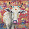 A limited edition giclee print of a beautiful white Indian cow with holy red tika on her forehead. She's placed against a hot pink background interspersed with striking cobalt blue rangoli patterns. There is an ornate gold block print through the background and a pink and gold sari border along the top.