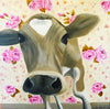 A photographic print of a brown cow with a rose wallpapered background.