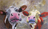 A limited edition giclee print of two cows on archival fine art paper.. The cow on the left retains her normal colouring whilst the one on the right is her alter ego who is 'dreaming' of being orange and yellow..