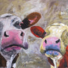 A limited edition giclee print of two cows on archival fine art paper.. The cow on the left retains her normal colouring whilst the one on the right is her alter ego who is 'dreaming' of being orange and yellow..